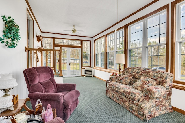 sunroom / solarium featuring crown molding, french doors, baseboards, and carpet floors
