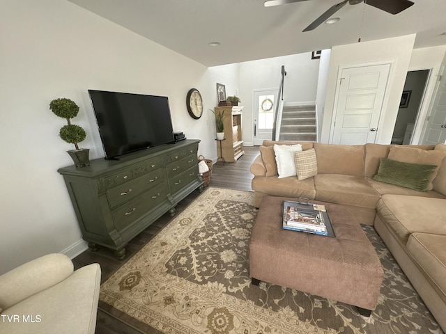 living area with dark wood-style floors, baseboards, recessed lighting, a ceiling fan, and stairway