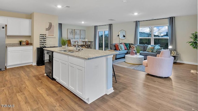 1128 Aspen Ter, Greeneville, TN 37745 - kitchen with a sink, dishwasher, light wood finished floors, a kitchen island with sink, and recessed lighting