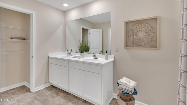 1128 Aspen Ter, Greeneville, TN 37745 - full bath featuring double vanity, a spacious closet, and baseboards