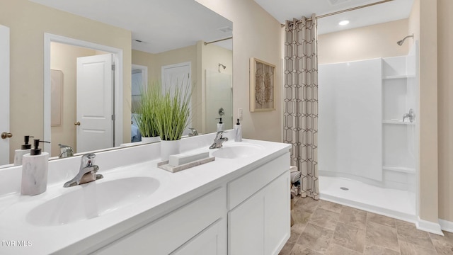 1128 Aspen Ter, Greeneville, TN 37745 - full bathroom featuring double vanity, a shower with curtain, and connected bathroom