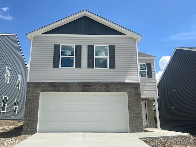 1128 Aspen Ter, Greeneville, TN 37745 - view of front of house with brick siding, driveway, and a garage