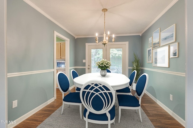 132 Lancaster Dr, Kingsport, TN 37663 - dining space featuring a chandelier, dark wood-type flooring, and ornamental molding