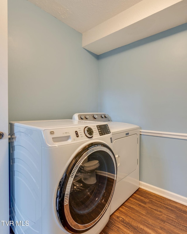 132 Lancaster Dr, Kingsport, TN 37663 - washroom with washing machine and clothes dryer and dark wood-type flooring