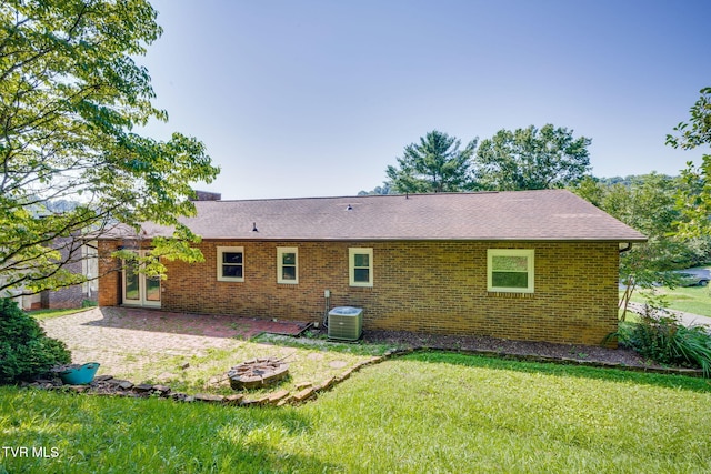 132 Lancaster Dr, Kingsport, TN 37663 - back of house with a patio area, a lawn, brick siding, and roof with shingles