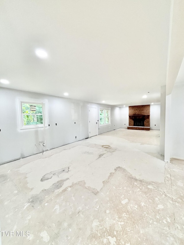 677 Summit Dr, Jonesborough, TN 37659 - unfurnished living room with a fireplace, plenty of natural light, and recessed lighting