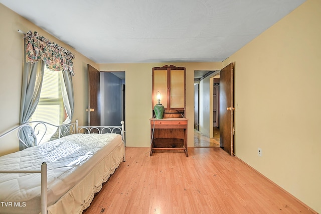 bedroom featuring light wood finished floors
