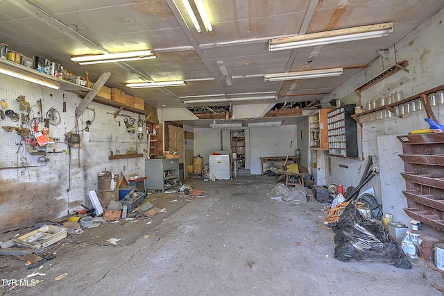 garage featuring washer / clothes dryer and a workshop area