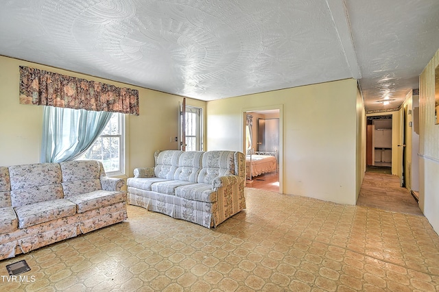 living room with a textured ceiling