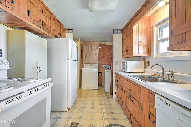 kitchen featuring a sink, light countertops, white appliances, brown cabinetry, and light floors