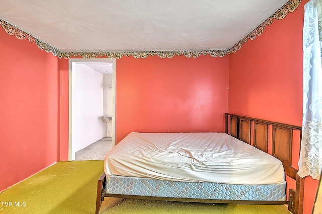 bedroom with light colored carpet
