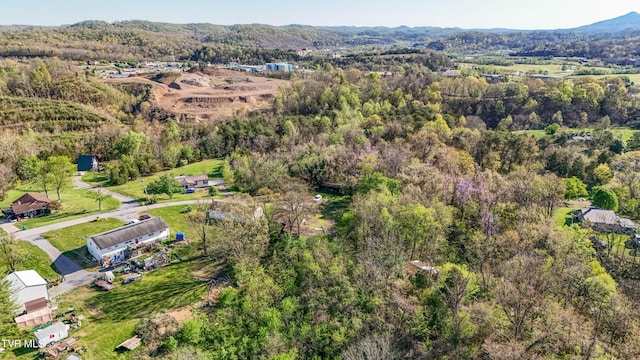 bird's eye view featuring a forest view