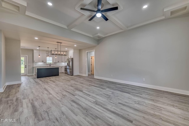 74 Slonaker Cir, Jonesborough, TN 37659 - unfurnished living room with ceiling fan, light wood-type flooring, coffered ceiling, and baseboards