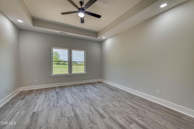 74 Slonaker Cir, Jonesborough, TN 37659 - unfurnished room featuring baseboards, recessed lighting, wood finished floors, and a raised ceiling