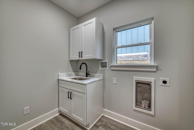 74 Slonaker Cir, Jonesborough, TN 37659 - laundry room with hookup for a washing machine, wood finished floors, hookup for an electric dryer, a sink, and baseboards