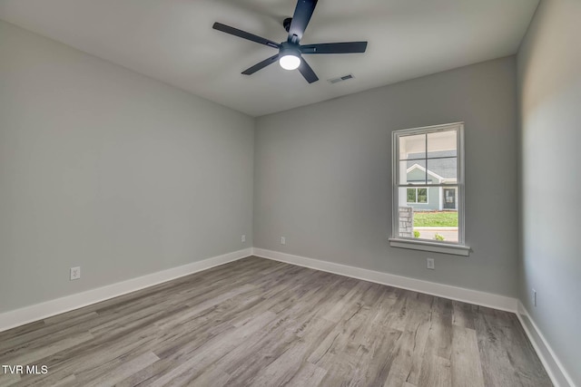 74 Slonaker Cir, Jonesborough, TN 37659 - unfurnished room with a ceiling fan, visible vents, wood finished floors, and baseboards