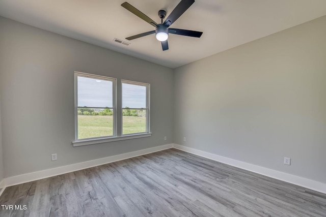 74 Slonaker Cir, Jonesborough, TN 37659 - empty room with baseboards, visible vents, wood finished floors, and a ceiling fan