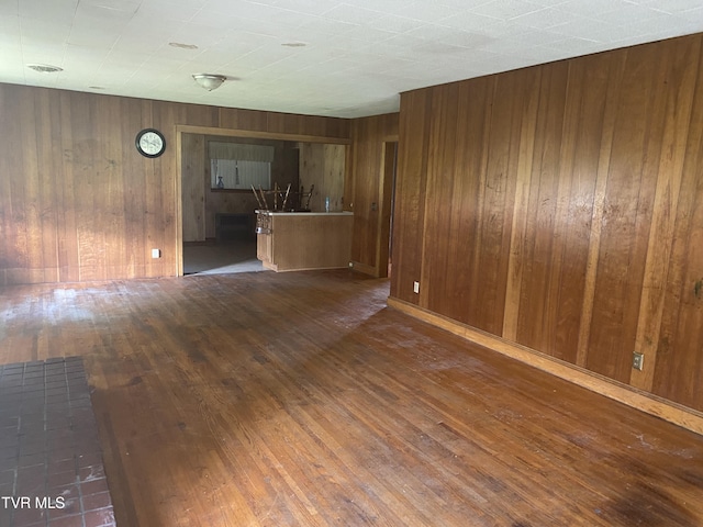 6192 Hurricane Rd, Wise, VA 24293 - unfurnished living room featuring wood-type flooring and wooden walls