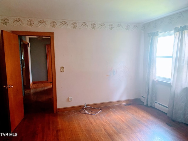 6192 Hurricane Rd, Wise, VA 24293 - spare room with wood finished floors and a baseboard heating unit