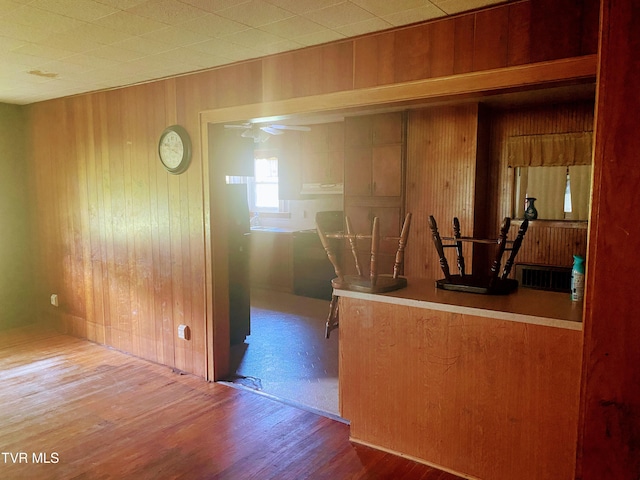 6192 Hurricane Rd, Wise, VA 24293 - kitchen featuring wood finished floors, wood walls, and ceiling fan