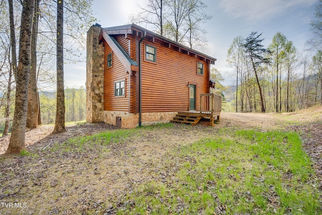 113 Tanner Dr, Elizabethton, TN 37643 - view of side of property featuring log siding and a chimney