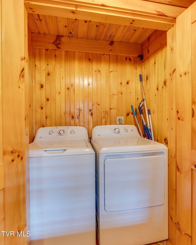 113 Tanner Dr, Elizabethton, TN 37643 - laundry room with wood walls, washer and clothes dryer, wooden ceiling, and laundry area