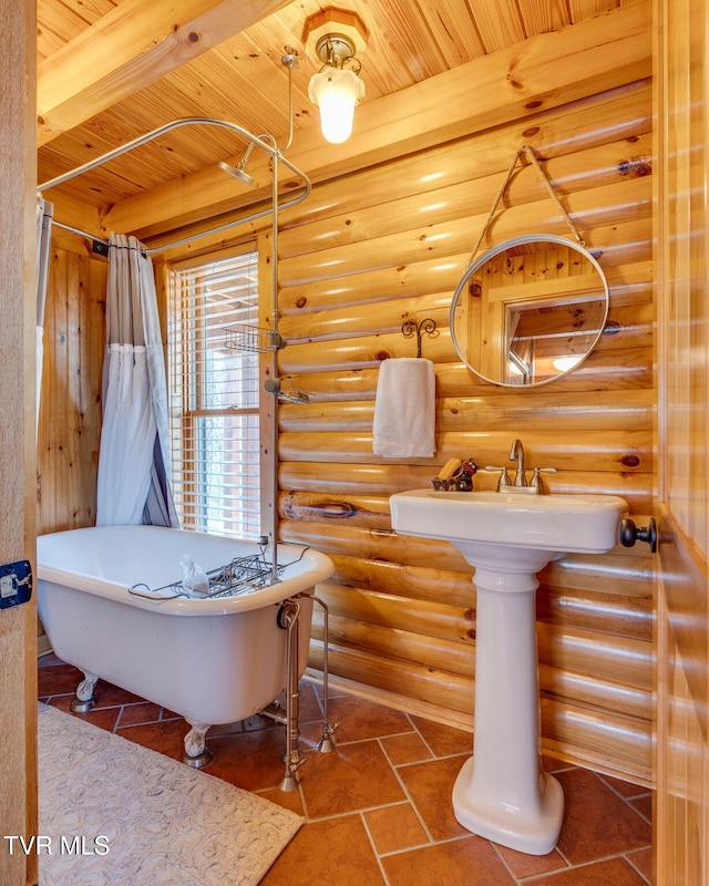 113 Tanner Dr, Elizabethton, TN 37643 - bathroom featuring tile patterned flooring, log walls, a soaking tub, and wood ceiling