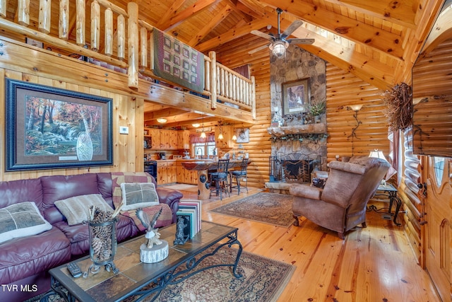 113 Tanner Dr, Elizabethton, TN 37643 - living area featuring high vaulted ceiling, a ceiling fan, rustic walls, hardwood / wood-style floors, and beam ceiling