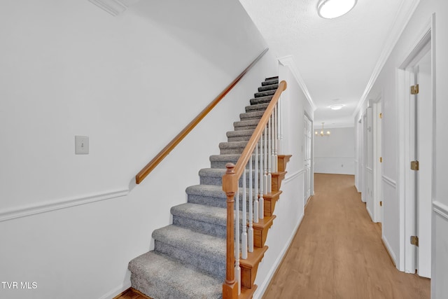 511 Hickory Rd Unit 511, Bristol, TN 37620 - stairs with crown molding, wood finished floors, an inviting chandelier, and baseboards