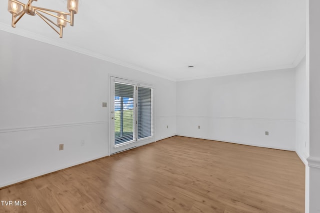 511 Hickory Rd Unit 511, Bristol, TN 37620 - unfurnished room with crown molding, baseboards, an inviting chandelier, and wood finished floors