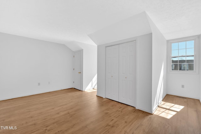 511 Hickory Rd Unit 511, Bristol, TN 37620 - unfurnished bedroom with a closet, light wood finished floors, baseboards, and lofted ceiling