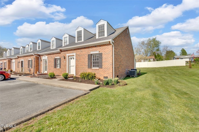 511 Hickory Rd Unit 511, Bristol, TN 37620 - view of front facade featuring central AC, crawl space, fence, a front lawn, and brick siding