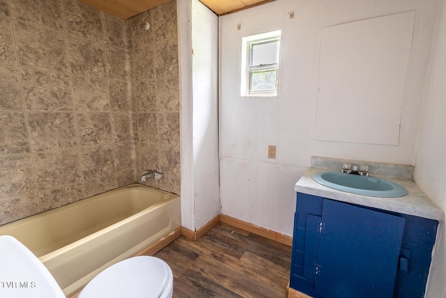 full bath featuring vanity, baseboards, toilet, shower / bathing tub combination, and wood finished floors