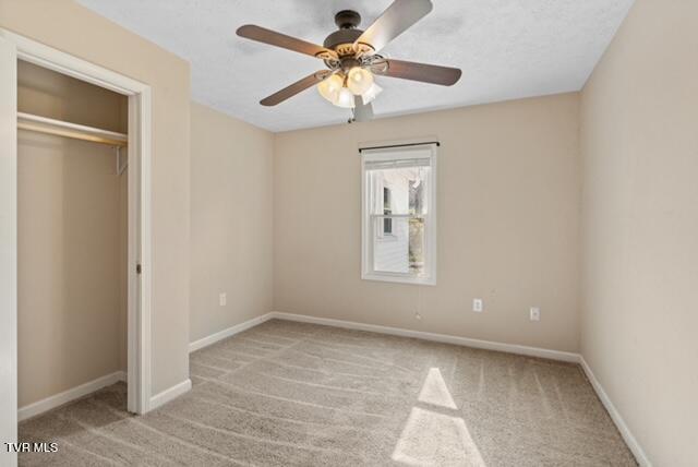 112 Morrow Ln, Greeneville, TN 37745 - unfurnished bedroom with a closet, carpet flooring, baseboards, and a ceiling fan