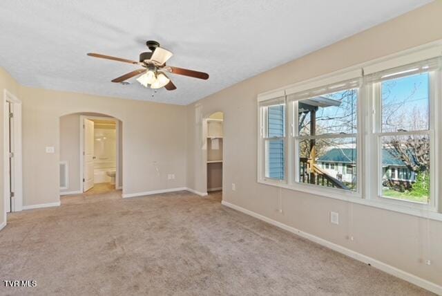 112 Morrow Ln, Greeneville, TN 37745 - spare room with carpet floors, ceiling fan, arched walkways, and baseboards