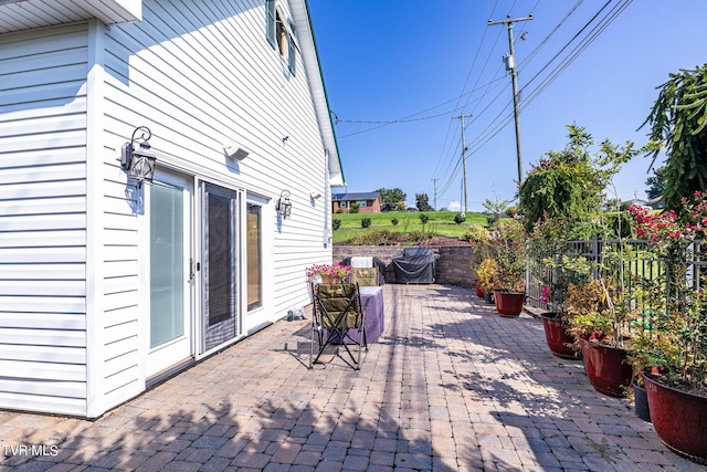 view of patio featuring fence