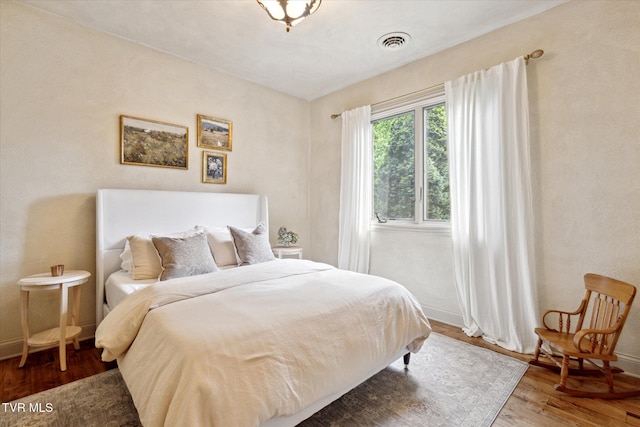 20268 Heron Cir, Abingdon, VA 24211 - bedroom featuring visible vents, baseboards, and wood finished floors