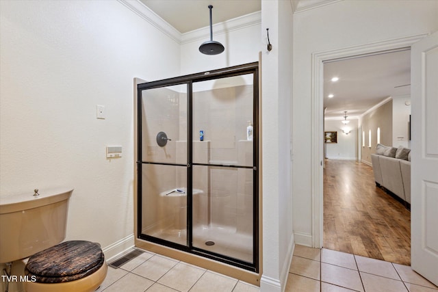 20268 Heron Cir, Abingdon, VA 24211 - bathroom with tile patterned flooring, ornamental molding, and a shower stall