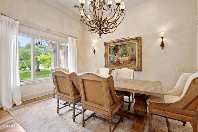 20268 Heron Cir, Abingdon, VA 24211 - dining room with an inviting chandelier, baseboards, crown molding, and light wood-type flooring