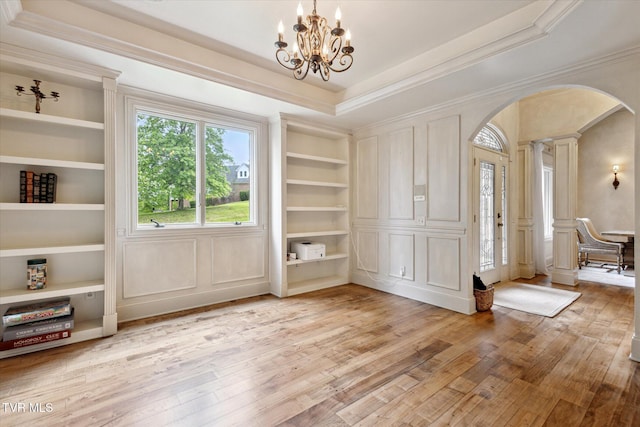 20268 Heron Cir, Abingdon, VA 24211 - entrance foyer with ornamental molding, light wood-type flooring, ornate columns, a chandelier, and arched walkways