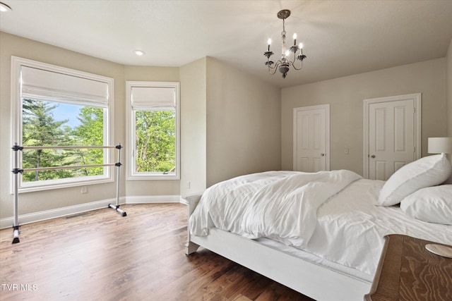 20268 Heron Cir, Abingdon, VA 24211 - bedroom with recessed lighting, baseboards, a notable chandelier, and wood finished floors
