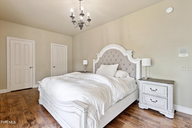 20268 Heron Cir, Abingdon, VA 24211 - bedroom featuring baseboards, wood finished floors, and a chandelier