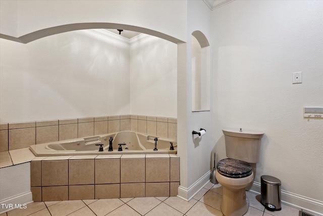 20268 Heron Cir, Abingdon, VA 24211 - bathroom with tile patterned flooring, toilet, baseboards, a tub with jets, and ornamental molding