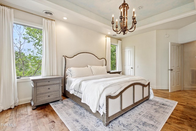20268 Heron Cir, Abingdon, VA 24211 - bedroom featuring an inviting chandelier, baseboards, light wood-style floors, and visible vents