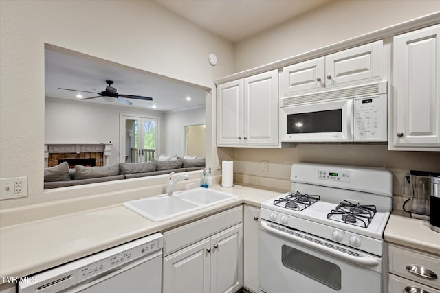 20268 Heron Cir, Abingdon, VA 24211 - kitchen featuring a sink, light countertops, white cabinets, and white appliances