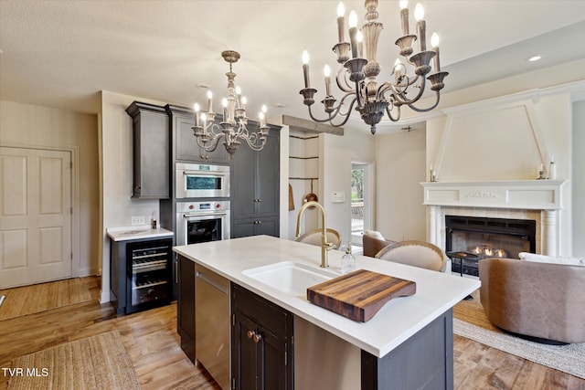 20268 Heron Cir, Abingdon, VA 24211 - kitchen with an inviting chandelier, a sink, appliances with stainless steel finishes, and light countertops