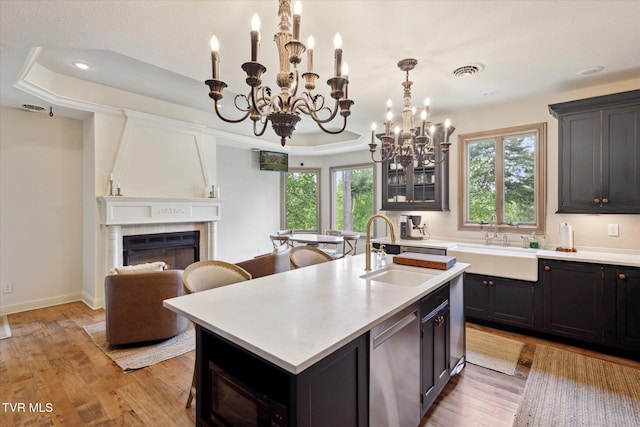 20268 Heron Cir, Abingdon, VA 24211 - kitchen featuring stainless steel dishwasher, a sink, a notable chandelier, and a tray ceiling
