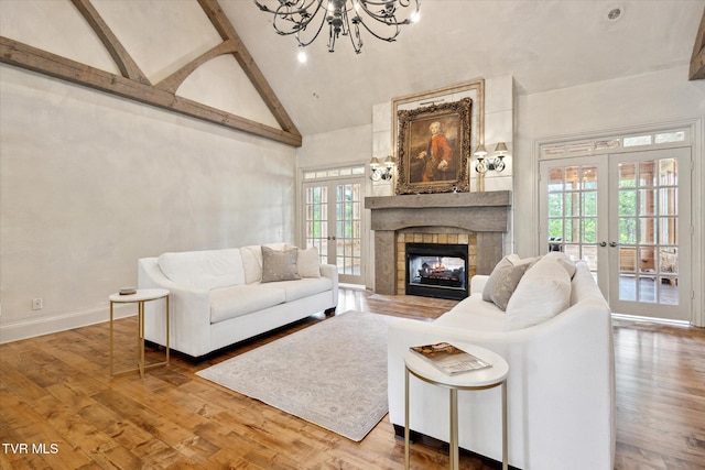 20268 Heron Cir, Abingdon, VA 24211 - living area with high vaulted ceiling, french doors, wood finished floors, and a chandelier