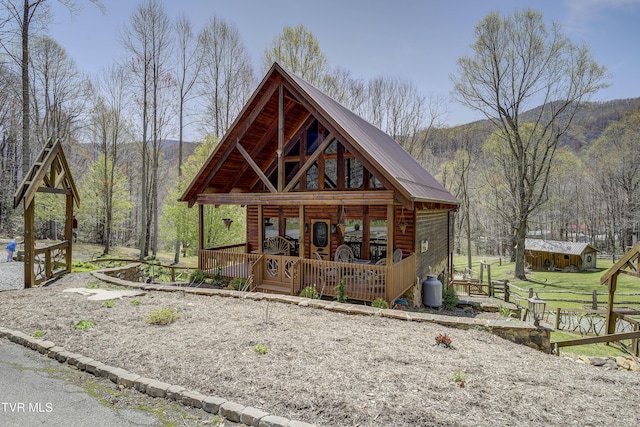 223 Black Bear Rdg, Roan Mountain, TN 37687 - view of front of home featuring a mountain view and metal roof