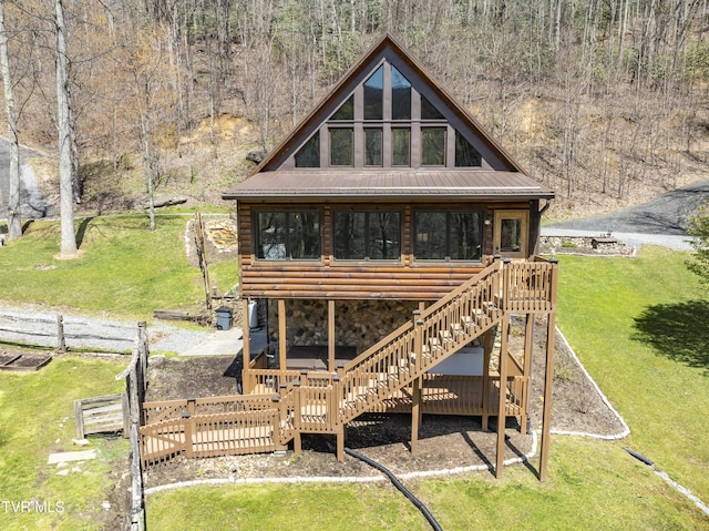 223 Black Bear Rdg, Roan Mountain, TN 37687 - back of property with a deck, metal roof, faux log siding, and stone siding